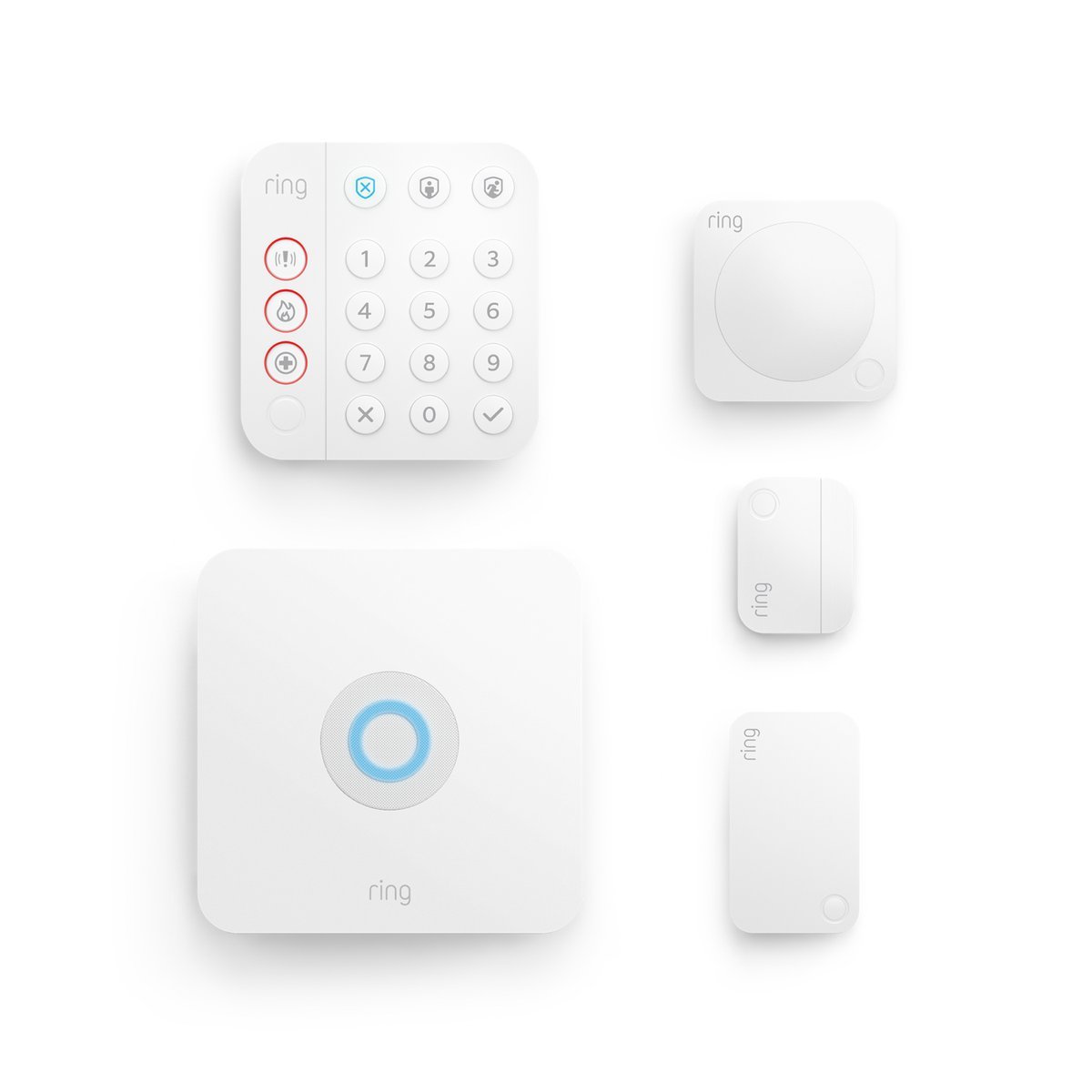 Ring Alarm 5-Piece Kit components laid out: keypad, base station, motion detector, contact sensor and range extender